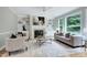Inviting living room with built-in bookshelves, a cozy fireplace, and comfortable seating at 500 Walcott Way, Cary, NC 27519