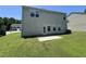 Spacious back yard featuring a concrete patio and rear view of the home at 5819 Finestra Way, Raleigh, NC 27610