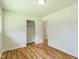 Spacious bedroom with hardwood floors, a closet and an entrance at 605 Sagefield Way, Henderson, NC 27537