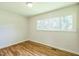 Sunlit bedroom with hardwood floors, a closet and bright window at 605 Sagefield Way, Henderson, NC 27537