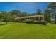Exterior shot of a brick home, showcasing the manicured lawn and front facade at 605 Sagefield Way, Henderson, NC 27537