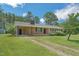 Brick house showing long driveway and side door entrance at 605 Sagefield Way, Henderson, NC 27537