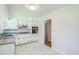 Traditional kitchen with white cabinets, granite countertops, and stainless steel appliances at 605 Sagefield Way, Henderson, NC 27537
