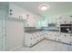Traditional kitchen with white cabinets, modern hardware and marble style tile floors at 605 Sagefield Way, Henderson, NC 27537