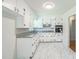 Updated kitchen with white cabinets, granite countertops, and stainless steel appliances at 605 Sagefield Way, Henderson, NC 27537