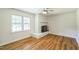 The living room features a fireplace with windows for natural light at 605 Sagefield Way, Henderson, NC 27537