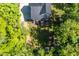 Aerial view highlighting the home's layout and the expansive, shaded backyard at 605 W Holt St, Mebane, NC 27302