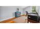 Home office featuring hardwood floors, printer, a blue bookshelf and natural light at 605 W Holt St, Mebane, NC 27302