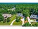 Aerial view of a stately house surrounded by mature trees at 619 Baybush Dr, Raleigh, NC 27615
