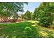 A large backyard is perfect for entertaining or recreation at 619 Baybush Dr, Raleigh, NC 27615