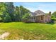 The lawn extends the full width of the house at 619 Baybush Dr, Raleigh, NC 27615