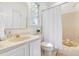 Cozy bathroom with vanity and combination shower and bathtub with window above at 619 Baybush Dr, Raleigh, NC 27615