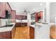 Modern kitchen with stainless steel refrigerator, wood cabinets, and bar seating; an open, spacious layout at 619 Baybush Dr, Raleigh, NC 27615