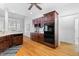 Well-appointed kitchen with dark wood cabinetry, modern appliances, and a view into the breakfast nook at 619 Baybush Dr, Raleigh, NC 27615