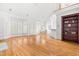Bright, open living space with hardwood floors, tall ceilings and large windows with shutters at 619 Baybush Dr, Raleigh, NC 27615
