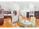 Bright, open-concept kitchen and living space with hardwood floors, fireplace, and cathedral ceilings at 619 Baybush Dr, Raleigh, NC 27615