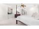 Comfortable main bedroom with four poster bed, tray ceiling, and TV in built in cabinet at 619 Baybush Dr, Raleigh, NC 27615