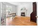 Cozy home office features hardwood floors, a fireplace, and a large window offering natural light at 619 Baybush Dr, Raleigh, NC 27615