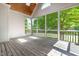 Enjoy nature from the screened porch with vaulted wood ceilings at 619 Baybush Dr, Raleigh, NC 27615