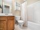 Bathroom with white shower curtain, toilet and a sink vanity with plenty of storage at 6228 Saybrooke Dr, Raleigh, NC 27604