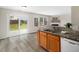 Bright and airy kitchen with granite countertops, overlooks the backyard and seamlessly connects to the adjacent living area at 6228 Saybrooke Dr, Raleigh, NC 27604
