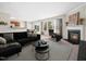 Spacious living room with a fireplace, a comfortable couch and backyard access at 6228 Saybrooke Dr, Raleigh, NC 27604