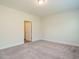 Bedroom featuring neutral carpet and an entry door at 660 Still Willow Ln, Wendell, NC 27591