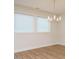 Bright dining area features hardwood floors and a modern chandelier at 660 Still Willow Ln, Wendell, NC 27591