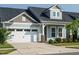 Lovely single-Gathering home with a two-car garage, inviting facade, and manicured front lawn and walkway at 660 Still Willow Ln, Wendell, NC 27591