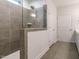 Modern bathroom featuring a spacious shower with sleek tile and a glass enclosure at 660 Still Willow Ln, Wendell, NC 27591