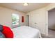 Bedroom boasts natural light, spacious closet, and serene atmosphere, enhancing comfort and functionality at 7809 Lillyhurst Dr, Raleigh, NC 27612
