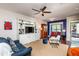 Cozy living room featuring a built-in entertainment center, ceiling fan, and comfortable seating at 7809 Lillyhurst Dr, Raleigh, NC 27612