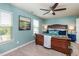 Comfortable main bedroom with a ceiling fan, two windows and soft, neutral carpet at 7809 Lillyhurst Dr, Raleigh, NC 27612