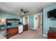 Relaxing main bedroom with an ensuite bath, ceiling fan and plush carpeted floors at 7809 Lillyhurst Dr, Raleigh, NC 27612