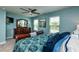 Spacious main bedroom featuring a ceiling fan, dresser, and a bright window at 7809 Lillyhurst Dr, Raleigh, NC 27612