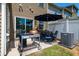 Cozy patio with grill, outdoor seating, and privacy fence at 7809 Lillyhurst Dr, Raleigh, NC 27612