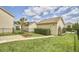 Well-maintained backyard featuring green grass, fencing, and a detached garage at 808 Historian St, Raleigh, NC 27603