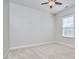 Bright, carpeted bedroom with a ceiling fan and a window providing natural light at 808 Historian St, Raleigh, NC 27603