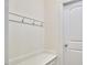 Neutral entryway with bench and coat hooks, perfect for organization at 808 Historian St, Raleigh, NC 27603