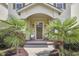 A cozy front porch with a neutral door with wreath and a lovely walkway at 808 Historian St, Raleigh, NC 27603