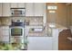 Gourmet kitchen with stainless steel appliances and granite countertops and island bar at 808 Historian St, Raleigh, NC 27603