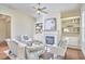 Inviting living room featuring a fireplace, built-in shelving, and hardwood floors at 808 Historian St, Raleigh, NC 27603