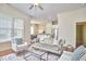 Living room with kitchen view shows the open concept floorplan, with lots of natural light at 808 Historian St, Raleigh, NC 27603