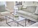 Comfortable seating area with a glass coffee table and an ornamental rug at 808 Historian St, Raleigh, NC 27603