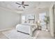 Spacious main bedroom featuring a tray ceiling, windows, and neutral tones at 808 Historian St, Raleigh, NC 27603