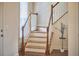 Staircase with wooden railings and white risers, adding a classic touch at 808 Historian St, Raleigh, NC 27603