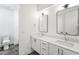 Modern bathroom with a double vanity, framed mirrors, and a toilet at 810 Culpepper Ln, Raleigh, NC 27610