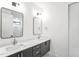 Well-lit bathroom featuring a double vanity with modern sinks and framed mirrors at 810 Culpepper Ln, Raleigh, NC 27610
