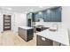 Stylish kitchen with dark blue cabinets, stainless steel appliances, white quartz countertops, and a central island at 810 Culpepper Ln, Raleigh, NC 27610