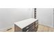 Kitchen island featuring white countertop, dark base cabinets, and stainless steel microwave at 810 Culpepper Ln, Raleigh, NC 27610